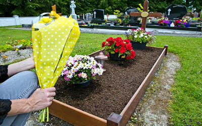 photo of eco-friendly burial site with flowers